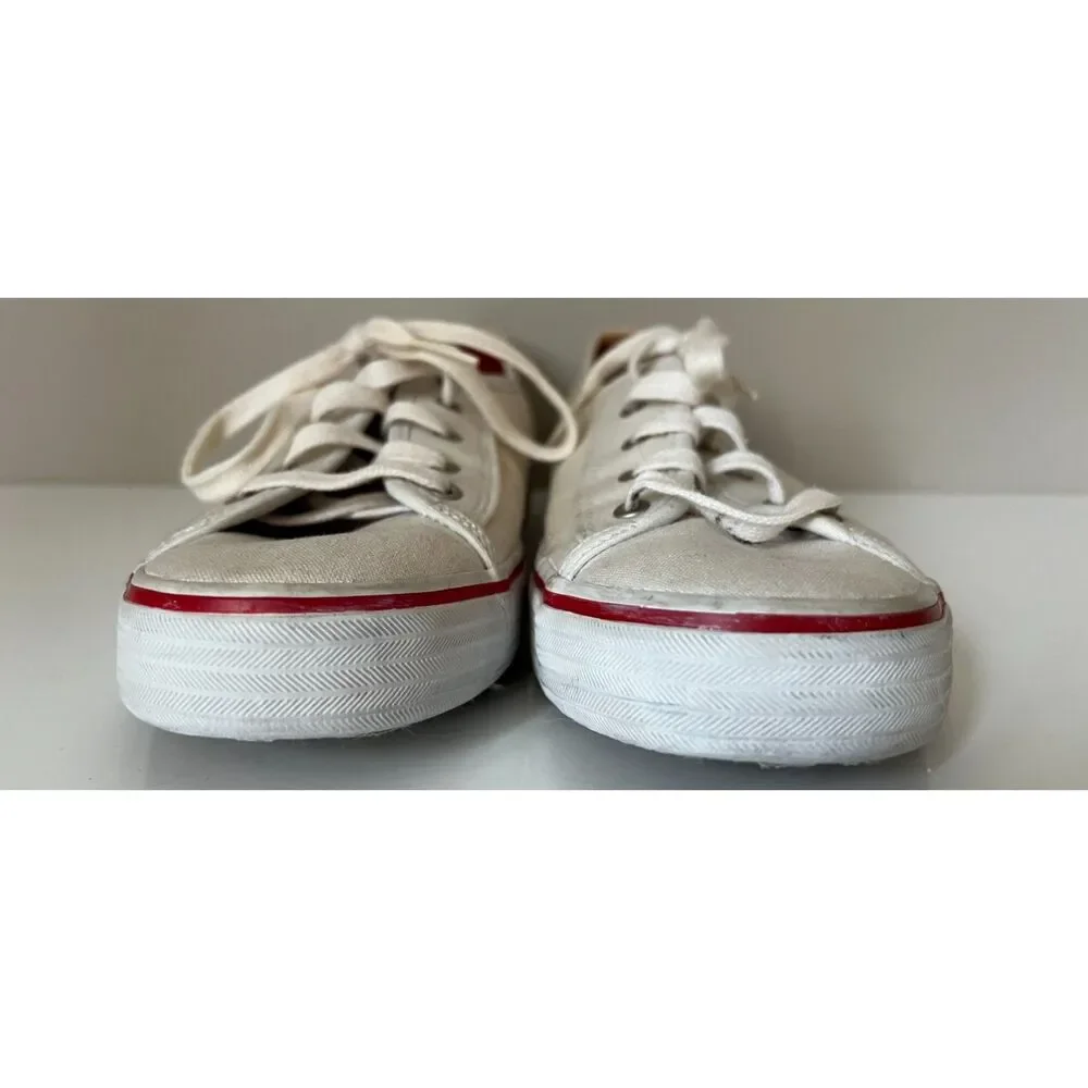 Keds low top canvas lace up sneakers with red trim. Size 8.